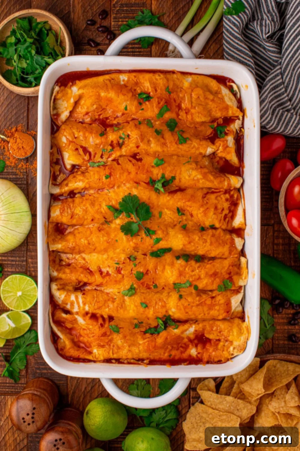 Beefy Enchiladas: A Fiesta of Flavor 12 Steak Enchiladas in a casserole dish with taco toppings