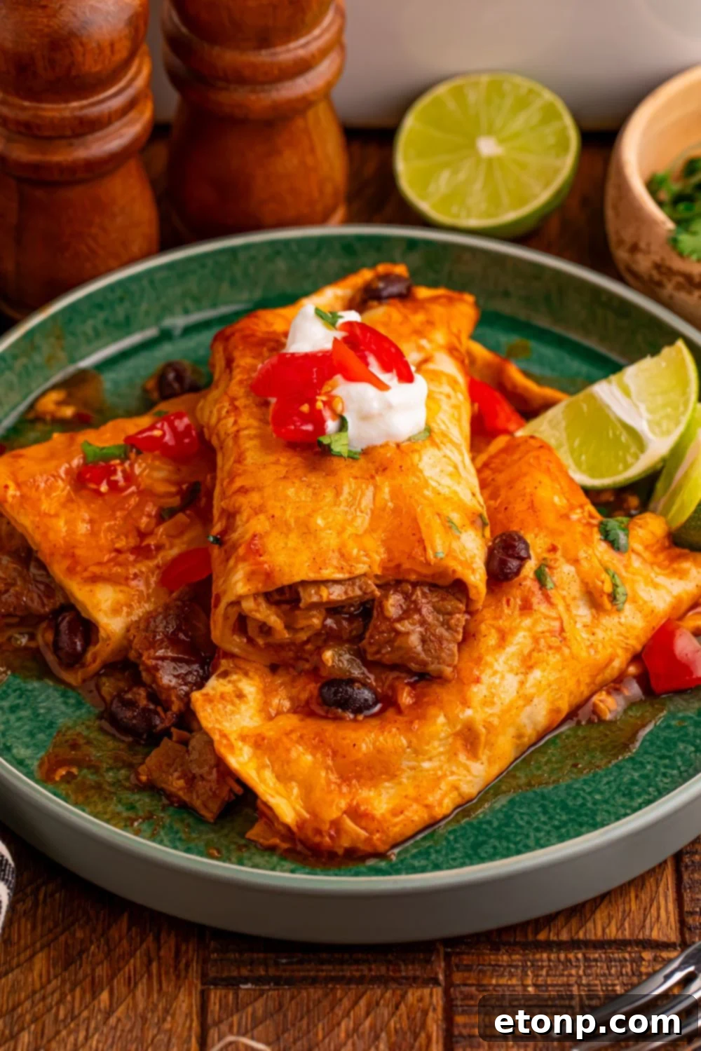 Beefy Enchiladas: A Fiesta of Flavor 16 Steak Enchiladas with sour cream, salsa, and lime