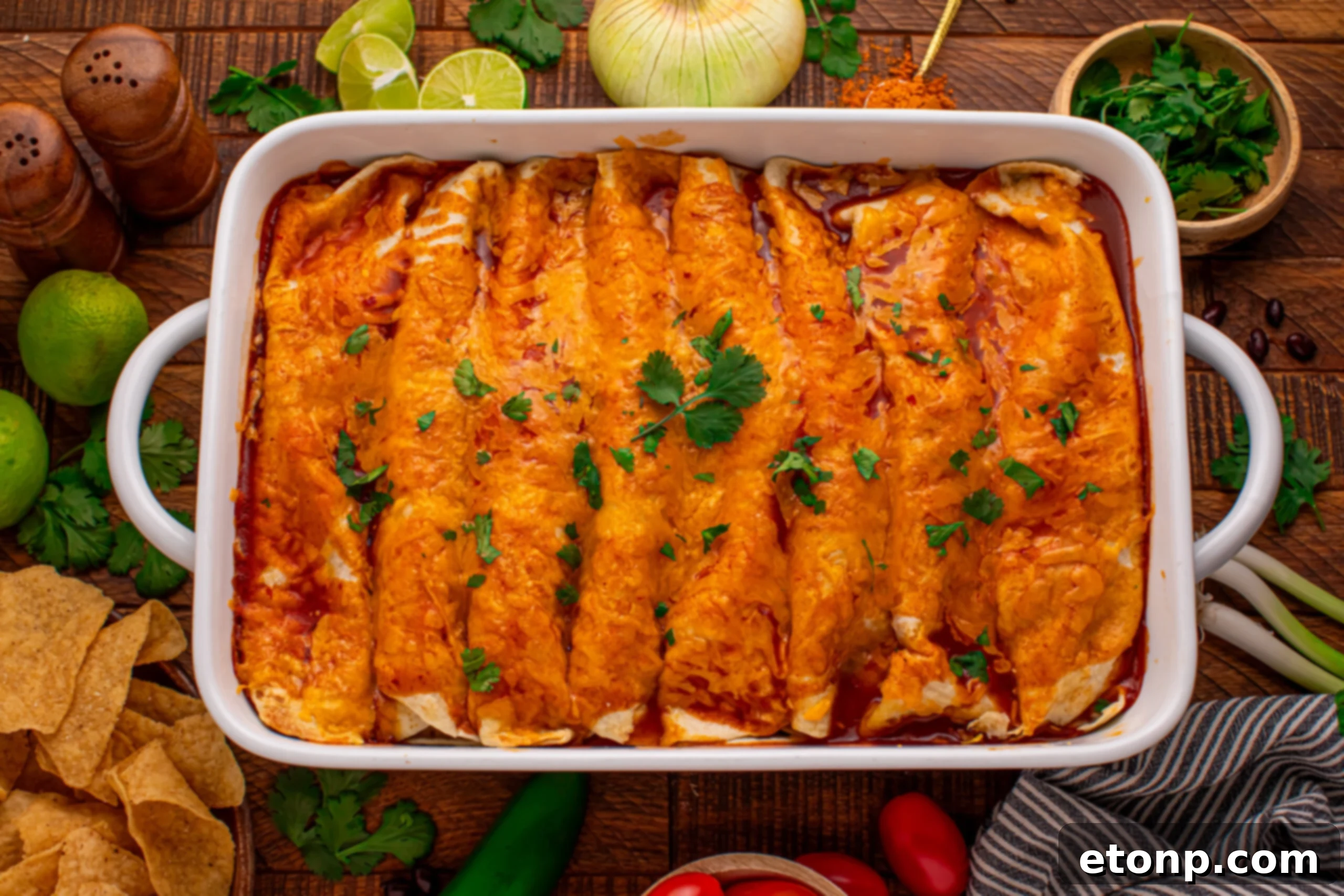 Beefy Enchiladas: A Fiesta of Flavor 17 Steak Enchiladas in a baking dish with sour cream and tomatoes
