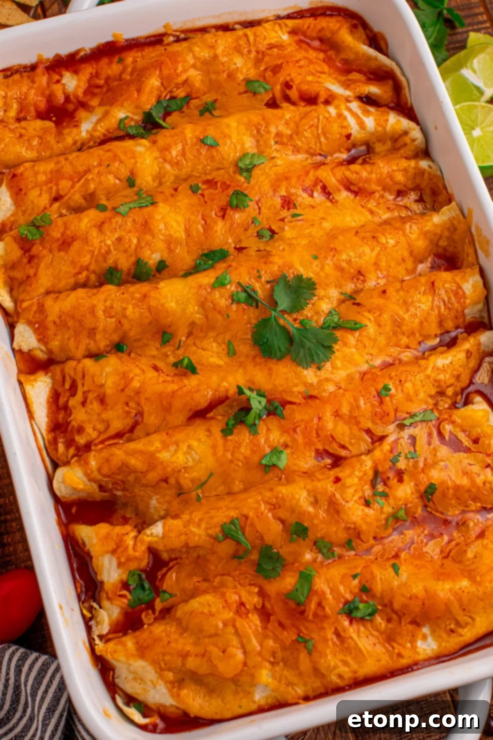 Beefy Enchiladas: A Fiesta of Flavor 19 Steak Enchiladas in a casserole dish with cilantro