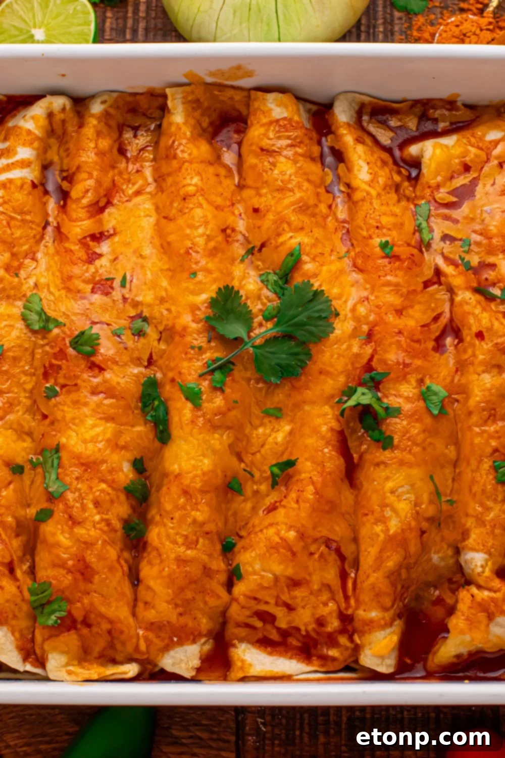 Beefy Enchiladas: A Fiesta of Flavor 22 Steak Enchiladas in a casserole dish with cilantro topping