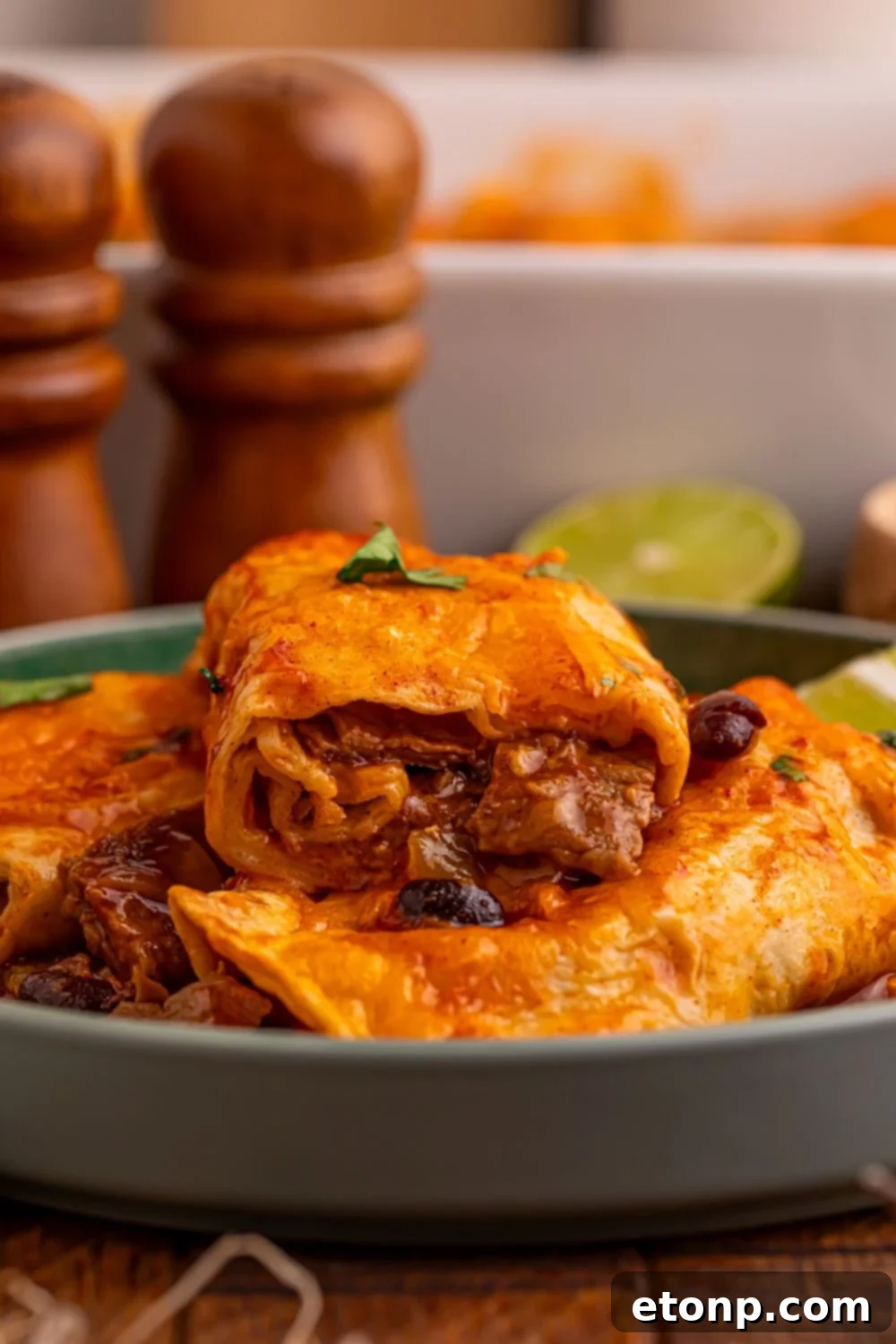 Beefy Enchiladas: A Fiesta of Flavor 24 Stacked Steak Enchiladas with limes and casserole dish