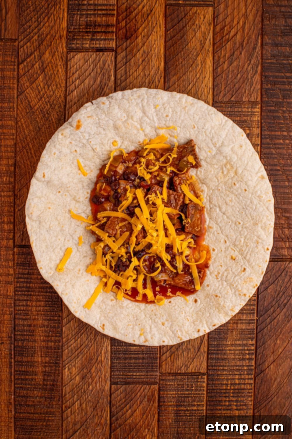Beefy Enchiladas: A Fiesta of Flavor 7 Tortilla filled with steak mixture
