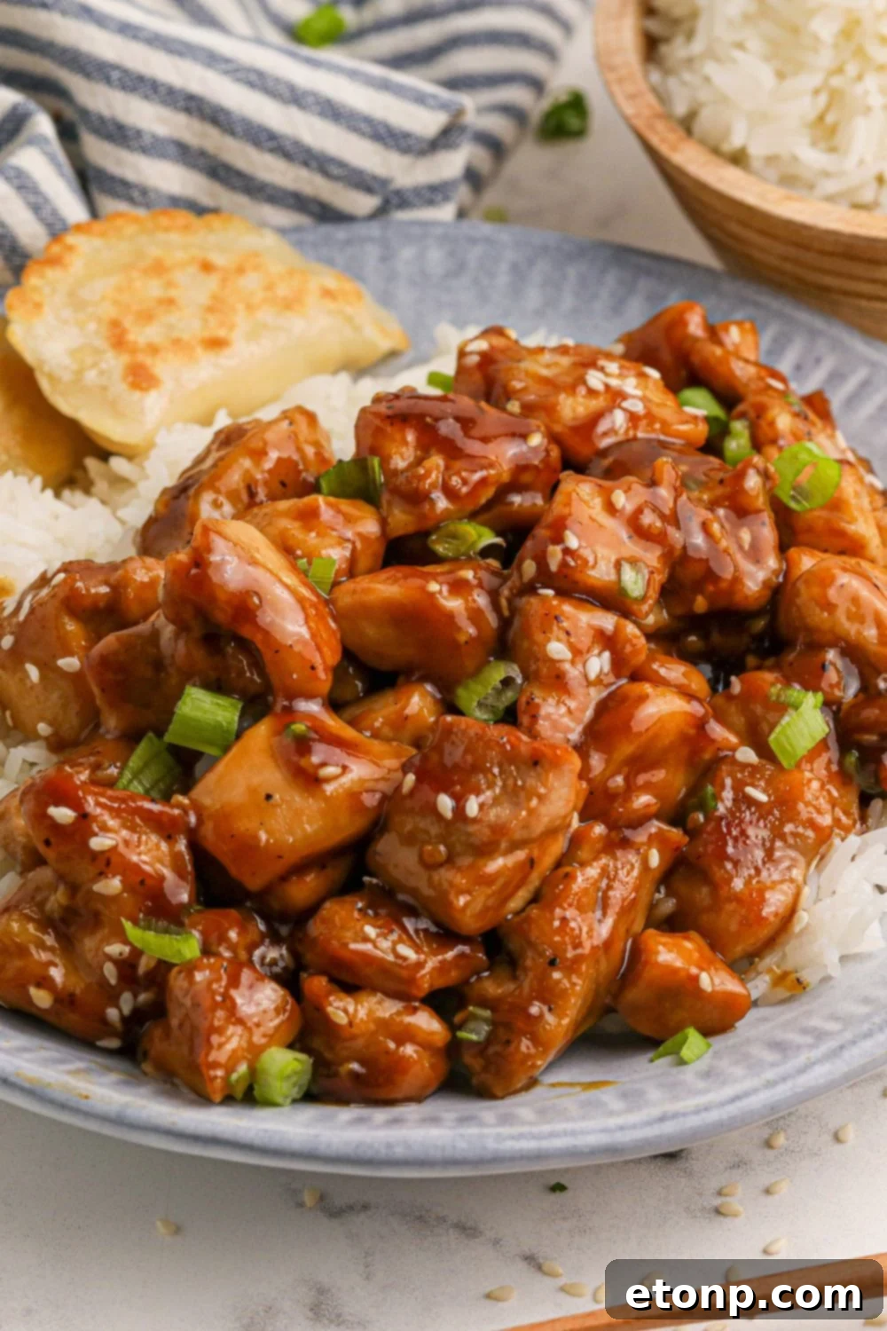 Bourbon Chicken with rice on a blue plate