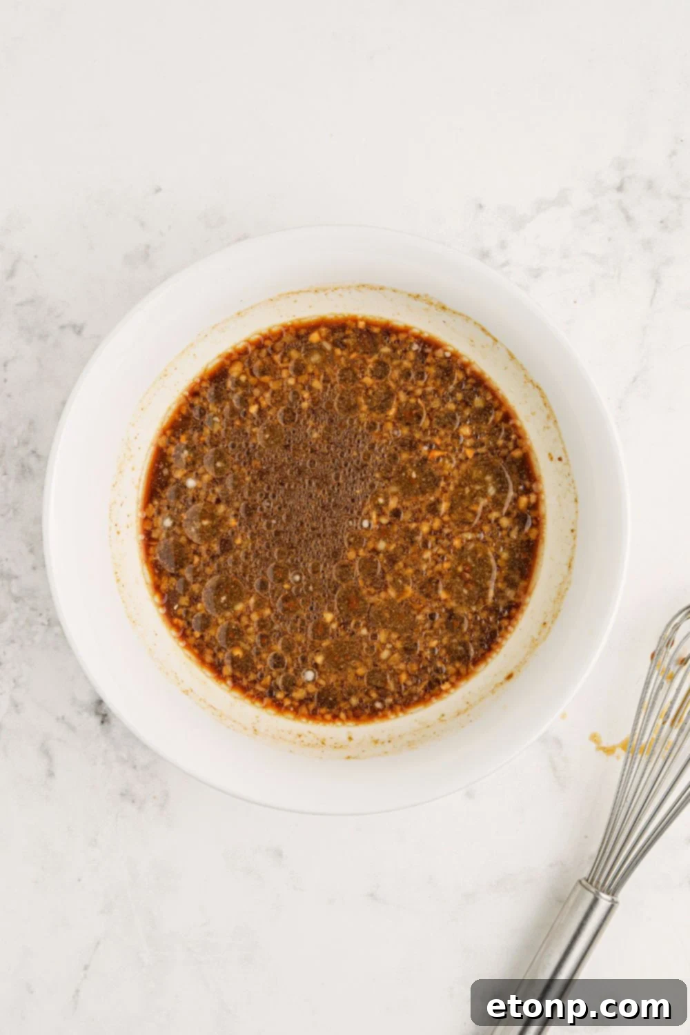 Bourbon sauce in a white bowl